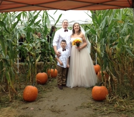 newlyweds in the hicks corn maze